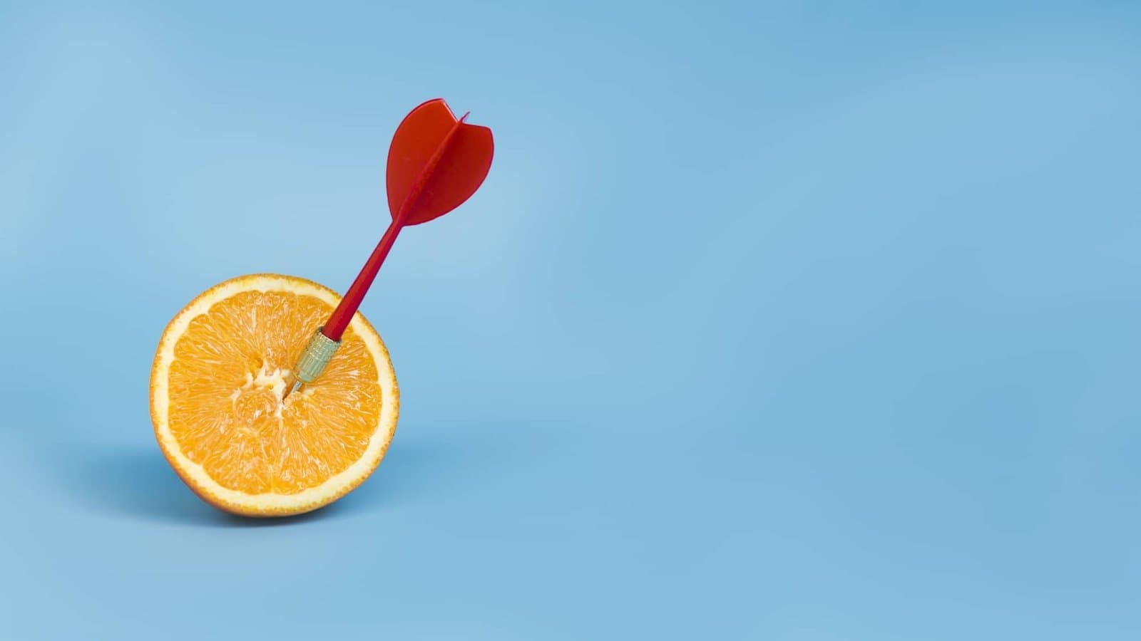 Dart hitting an orange target